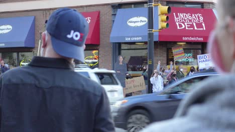 People-celebrating-Joe-Biden's-election-victory-in-the-streets-of-Boulder,-Colorado