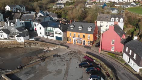 Summercove-in-Kinsale,-County-Cork,-Ireland-on-a-sunny-day-with-yellow-orange-The-Bulman-Pub-in-the-centre
