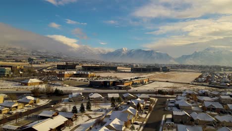 Panoramic-aerial-view-of-Lehi,-Utah-with-fresh-layer-of-snow-and-a-view-of-Silicon-Slopes