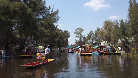 Colorful-Boats-Floating-on-Xochimilco-Canal,-UNESCO-World-Heritage-Site