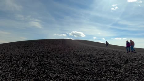 Timelapse-of-the-giant-cinder-cone-at-the-Craters-of-the-Moon-National-Monument-set-against-a-windy-blue-sky-and-billowing-clouds