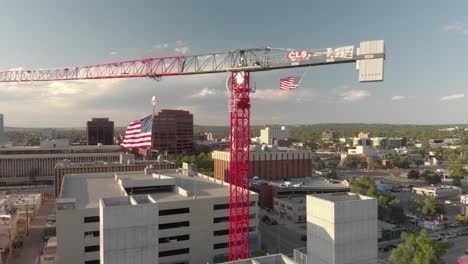 Large-urban-red-Saez-construction-crane-with-Stars-and-Stripes-flying