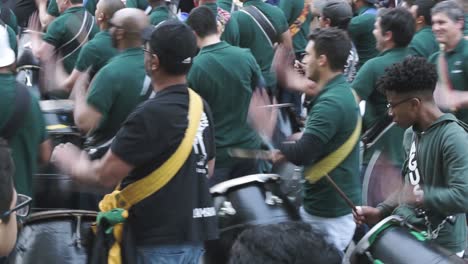 Men-playing-drums-in-parade.-Uruguay.-Handheld
