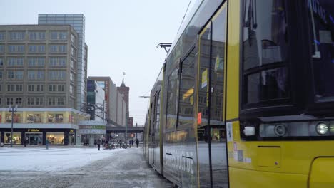 Typical-Yellow-Tram-in-Berlin-on-famous-Alexanderplatz-in-Winter