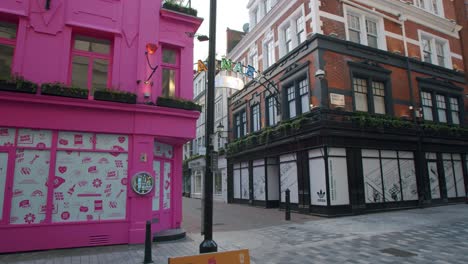 Lockdown-in-London,-empty-Carnaby-and-Kingly-Street,-Soho,-revealing-one-lone-person-walking,-during-the-COVID-19-pandemic-2020
