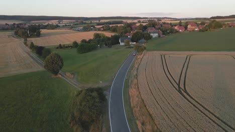 Drone-shot-following-a-car-in-Germany-town