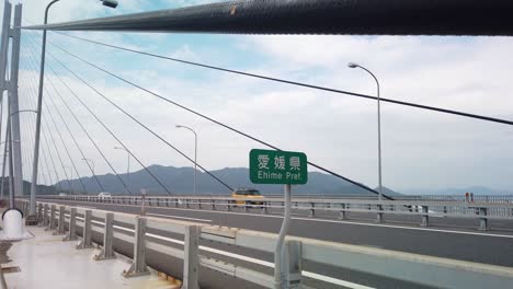 Ehime-Prefecture-Border-establishing-shot-at-Tatara-Bridge,-Tilt-Shot