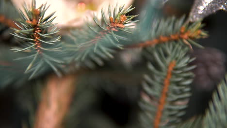 Detail-Of-A-Fir-Tree-Decorated-With-Christmas-Balls-And-Stars-In-Bokeh-Background