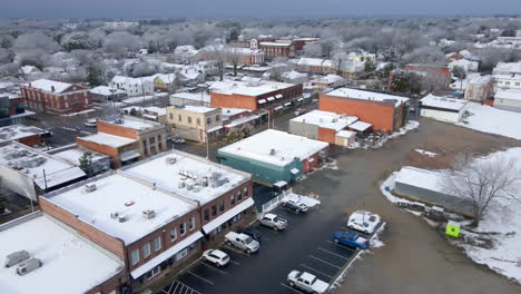 Drone-shot-of-snowfall-on-small-town-USA