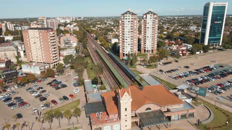 Aerial-establishing-shot-of-Tigre-train-station-flying-over-the-building-and-tracks