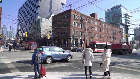 Toronto-King-Street-intersection-timelapse-with-people,-cars,-bikes-and-streetcars