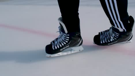 Ice-level-point-of-view-of-ice-skater-gliding-and-turning