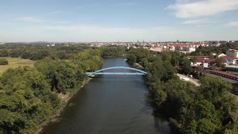 Aerial-View-of-a-boat-in-the-water-near-blue-bridge-in-Halle-Germany,