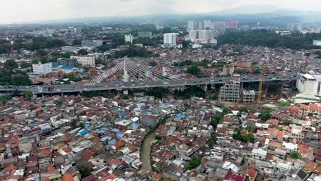 Pasupati-Cable-stayed-bridge-in-Bandung,-West-Java-Indonesia-with-heavy-traffic-during-the-day,-Aerial-close-in-shot