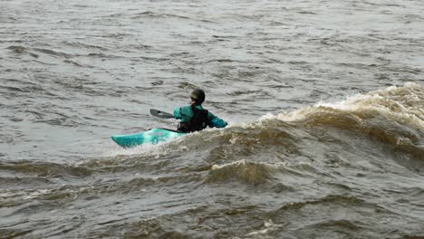 High-flood-season-on-the-Ottawa-River-and-a-Kayaker-rides-a-dangerous-rapid-area-of-the-river-which-has-created-waves