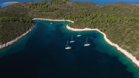 Sailboats-Floating-On-Calm-Blue-Water-Of-Adriatic-Sea-Between-Hvar-Island-In-Croatia
