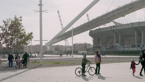 Pan-wide-shot-of-people-having-fun-at-Athens-Olympic-Complex-park,-on-Christmas-Day,-during-coronavirus-restrictions