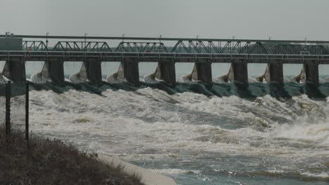 Water-rushing-through-the-levee-of-the-Hydro-Electric-Dam-on-the-Ottawa-River-at-ChaudiÃ¨re-Island-in-downtown-Ottawa,-Canada