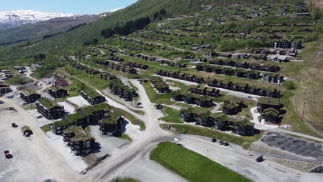 Beautiful-mountain-village-with-luxury-cabins-and-hotel-in-famous-mountain-village-of-Myrkdalen---Aerial