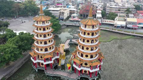 Sliding-with-a-bit-of-Circular-motion-View-of-Spectacular-Dragon-And-Tiger-Pagodas-Temple-With-Seven-Story-Tiered-Tower-Located-at-Lotus-Lake-at-Kaohsiung-City-Taiwan