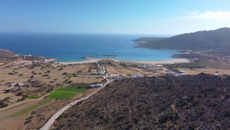 An-aerial-view-of-road-to-Magganari-beach,-Ios-island,-Greece