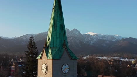 Close-Up-Of-Clock-Tower-Of-Holy-Family-Church-In-Krupowki,-Zakopane,-Poland