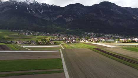Farmlands-in-valley-in-Alps-mountains
