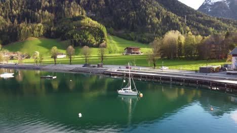 Little-yacht-on-alpine-lake-in-small-Tyrolean-village-Pertisau