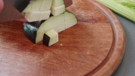 Close-up-of-cutting-an-aubergine--into-cubes