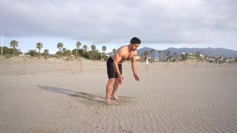 training-variant-of-push-ups-with-slap-on-beach-with-palm-trees-in-the-background