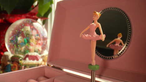 Christmas-magic-as-a-ballerina-slowly-spins-in-front-of-a-snow-globe