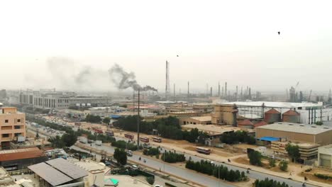 Aerial-View-Of-Highway-In-Karachi-With-Factory-Smoke-In-Background