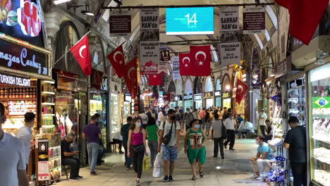 Tilt-down-from-Turkish-flag-to-interior-street-of-the-Grand-Bazaar-in-Istanbul
