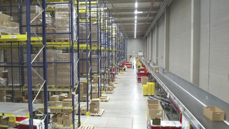 Aerial-Shot-Inside-Shipping-Distribution-Warehouse,-International-Courier-Industry