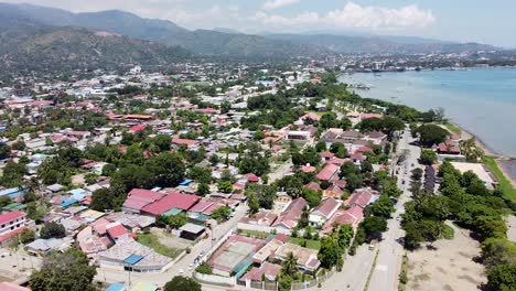 Rising-drone-footage-of-Dili,-the-Capital-of-Timor-Leste-in-South-East-Asia