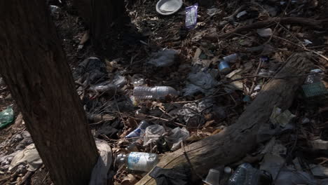 Wide-panning-shot-showing-garbage-strewn-in-a-city-ravine