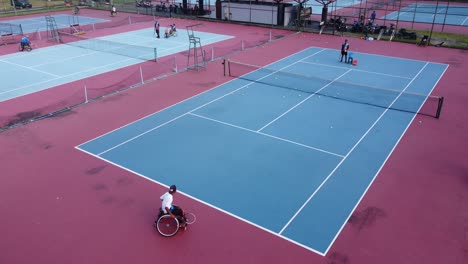 Yogyakarta,-Indonesia---May-2,-2021-:-People-in-wheelchair-playing-tennis-on-court