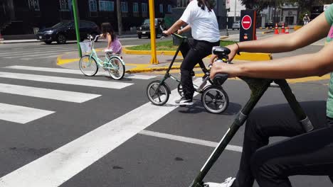 4k-Slow-motion-video-of-girl-cycling-on-the-famous-Arequipa-boulevard-in-the-capital-city-of-Lima,-Peru,-on-a-sunny-Sunday-afternoon