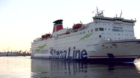 Wide-shot-of-cruising-Stena-Line-Ship-at-harbor-of-Gdynia-during-sunset-in-Poland