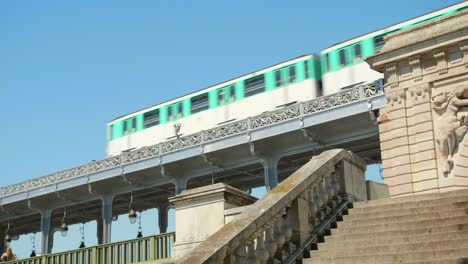 Subway-Train-Passing-Over-The-Bir-Hakeim-Bridge-At-Daytime-In-Paris,-France