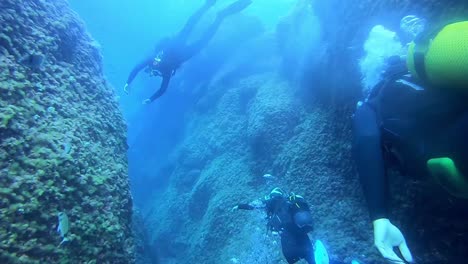 Divers-enjoying-the-sceneries-under-the-sea-of-Menorca-Island-Spain