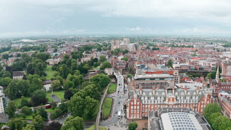 Low-establishing-drone-shot-towards-York-Minster-Cathedral-over-city-wall-cloudy-day
