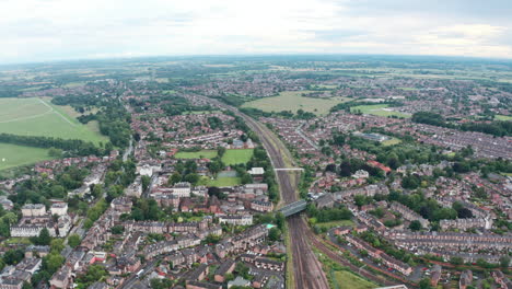 Drone-shot-over-train-tracks-leaving-York-England