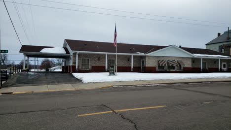 Small-town-funeral-home-in-winter-with-snow