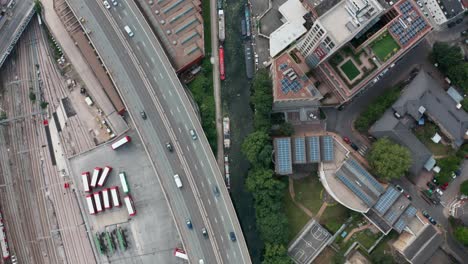 Top-down-drone-shot-over-peaceful-London-canal-system-with-narrow-boats