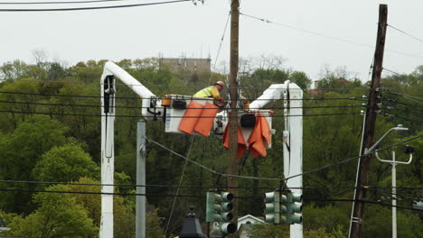 Close-up-of-construction-workers-doing-maintenance-to-power-cables