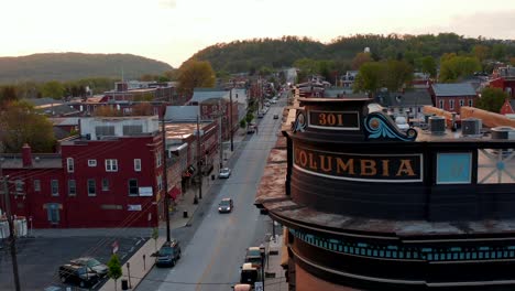 Aerial-reveal-of-Columbia-town-during-golden-sunset