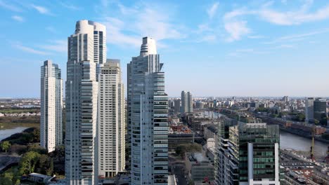 Aerial-pull-out-view-of-skyscrapers-at-Puerto-Madero,-Buenos-Aires,-revealing-the-cityscape