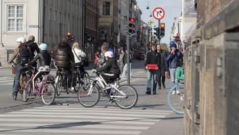 Crowd-of-city-bikers-and-pedestrians-on-streets-in-Copenhagen-city
