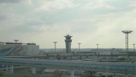 Wide-establishing-view-of-Paris-Orly-airport-and-control-tower-with-traffic
